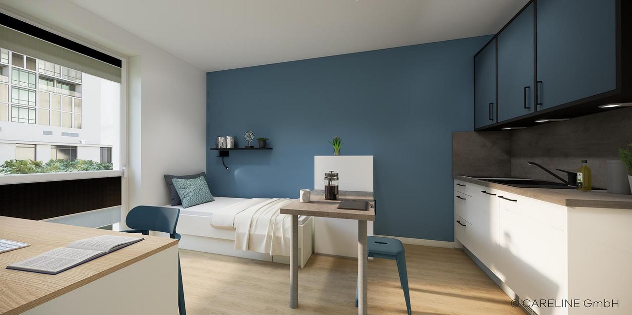 Apartmentüberblick Quartillion Wiesbaden mit Schreibtisch und Bett
